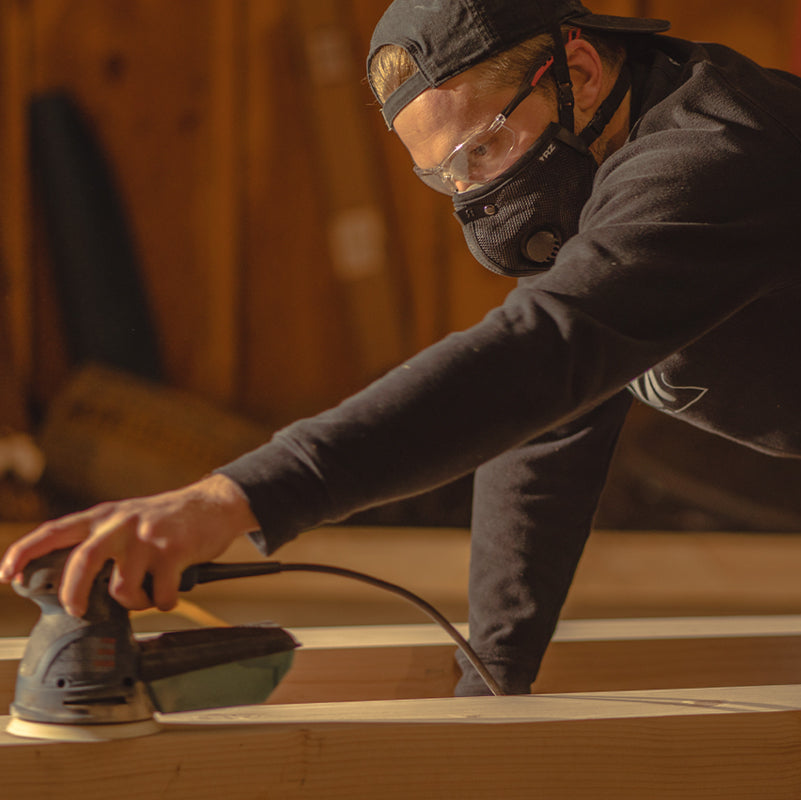 Man woodworking while wearing M2.5 RZ Mask