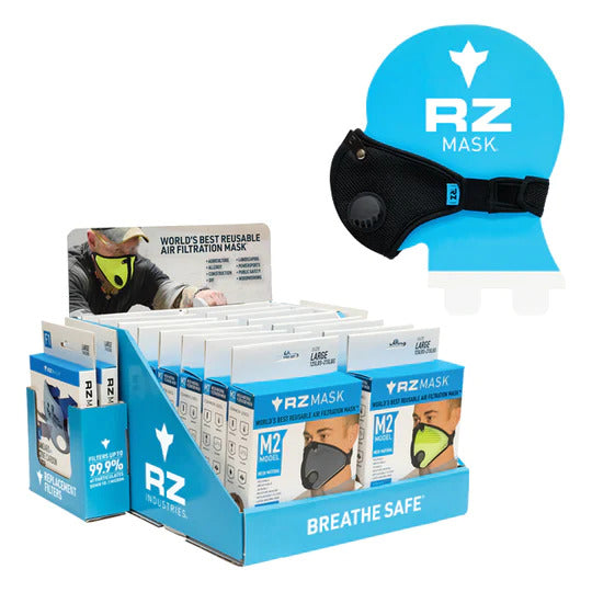 image of an rz mask counter top display loaded with m2 masks along with a mannequin head modeling an rz mask m2 black