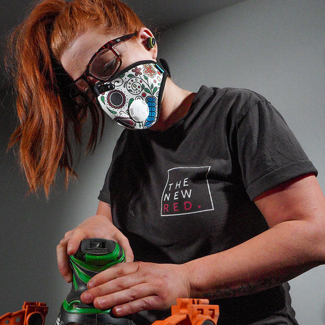 Woman woodworking while wearing M2N RZ Mask