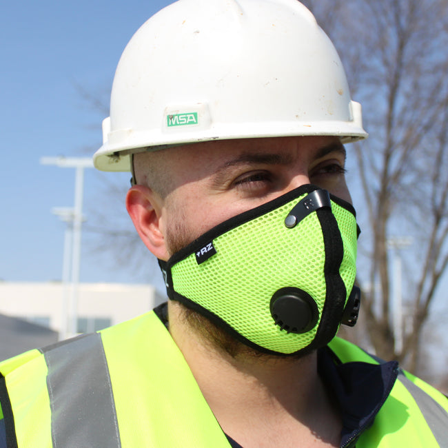 construction worker wearing rz mask safety yellow m2 at a job site